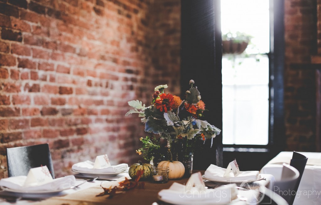 Table setting "bucket" flowers from Shady Grove Gardens and pumpkin gourds from the farmers market along with small pansy plants in mason jars. Adam Jennings Photography